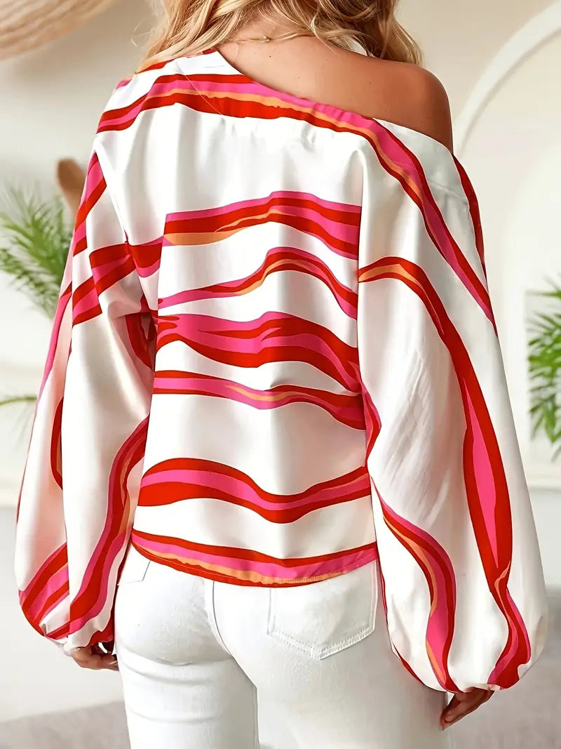 Philomena - Elegante blusa con hombros descubiertos y estampado geométrico.