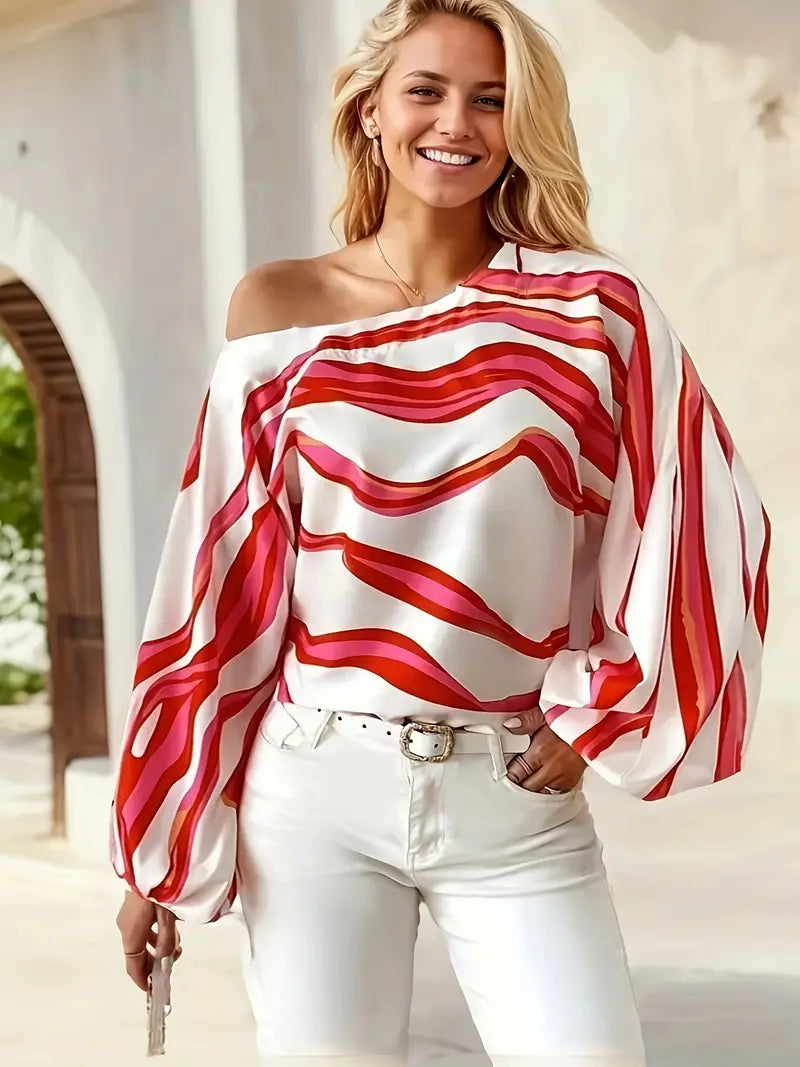 Philomena - Elegante blusa con hombros descubiertos y estampado geométrico.