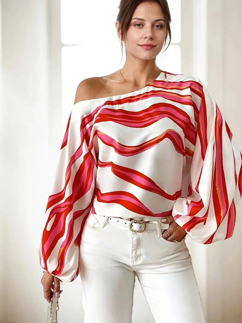 Philomena - Elegante blusa con hombros descubiertos y estampado geométrico.