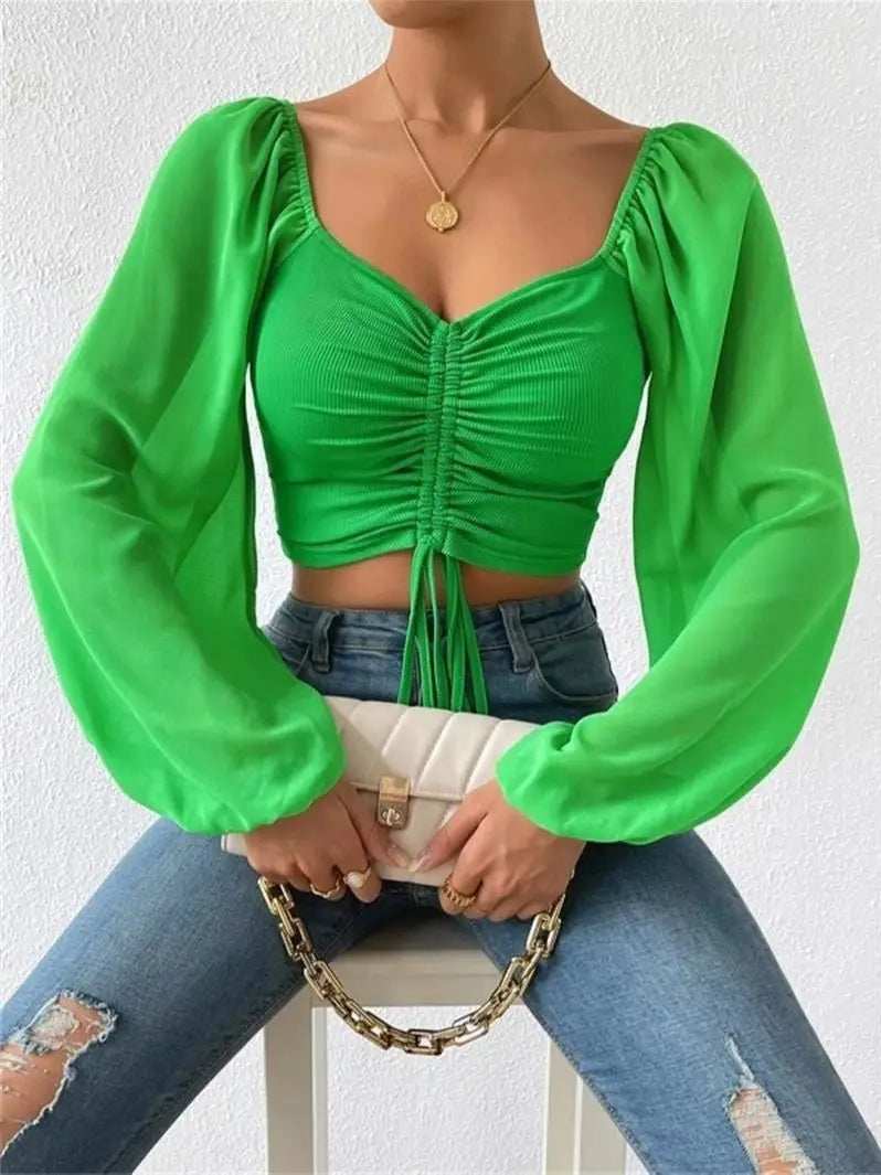 Shirley - Elegante top de manga larga abullonada