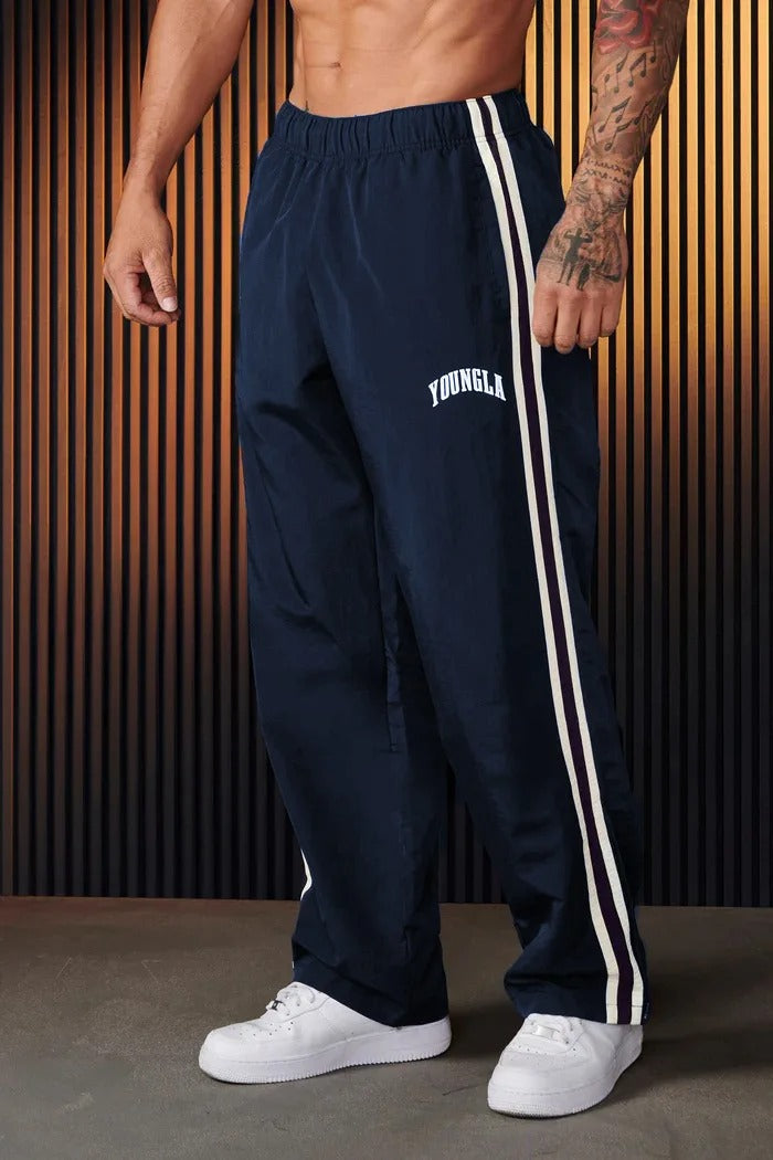 Bryan Pantalón deportivo de hombre con estampado de doble raya
