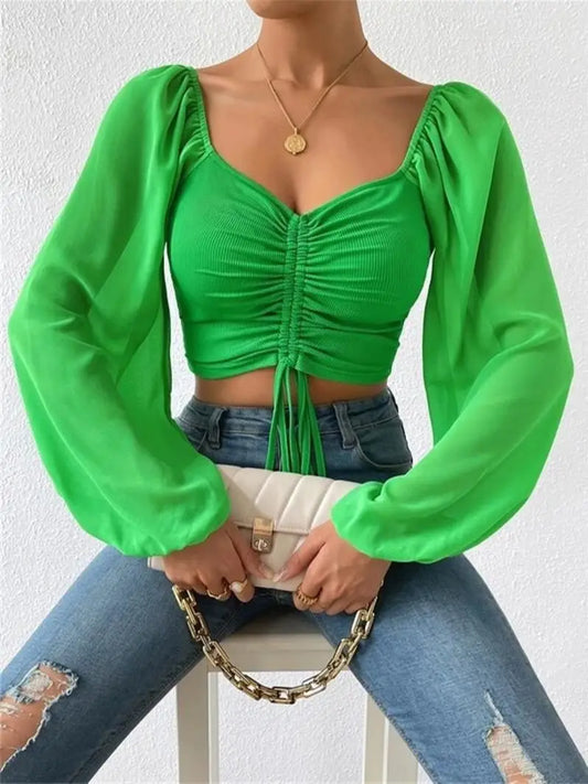 Shirley - Elegante top de manga larga abullonada